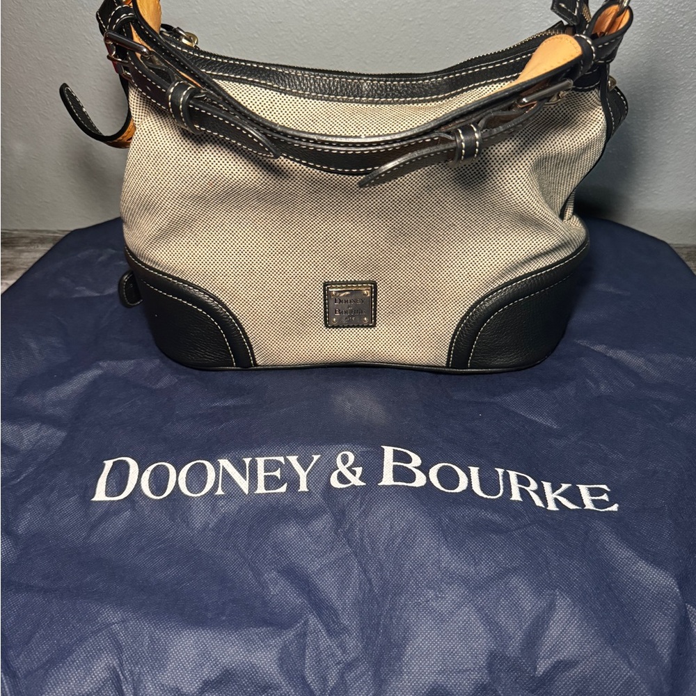 Dooney and Bourke Navy canvas hobo bag with small wristlet.